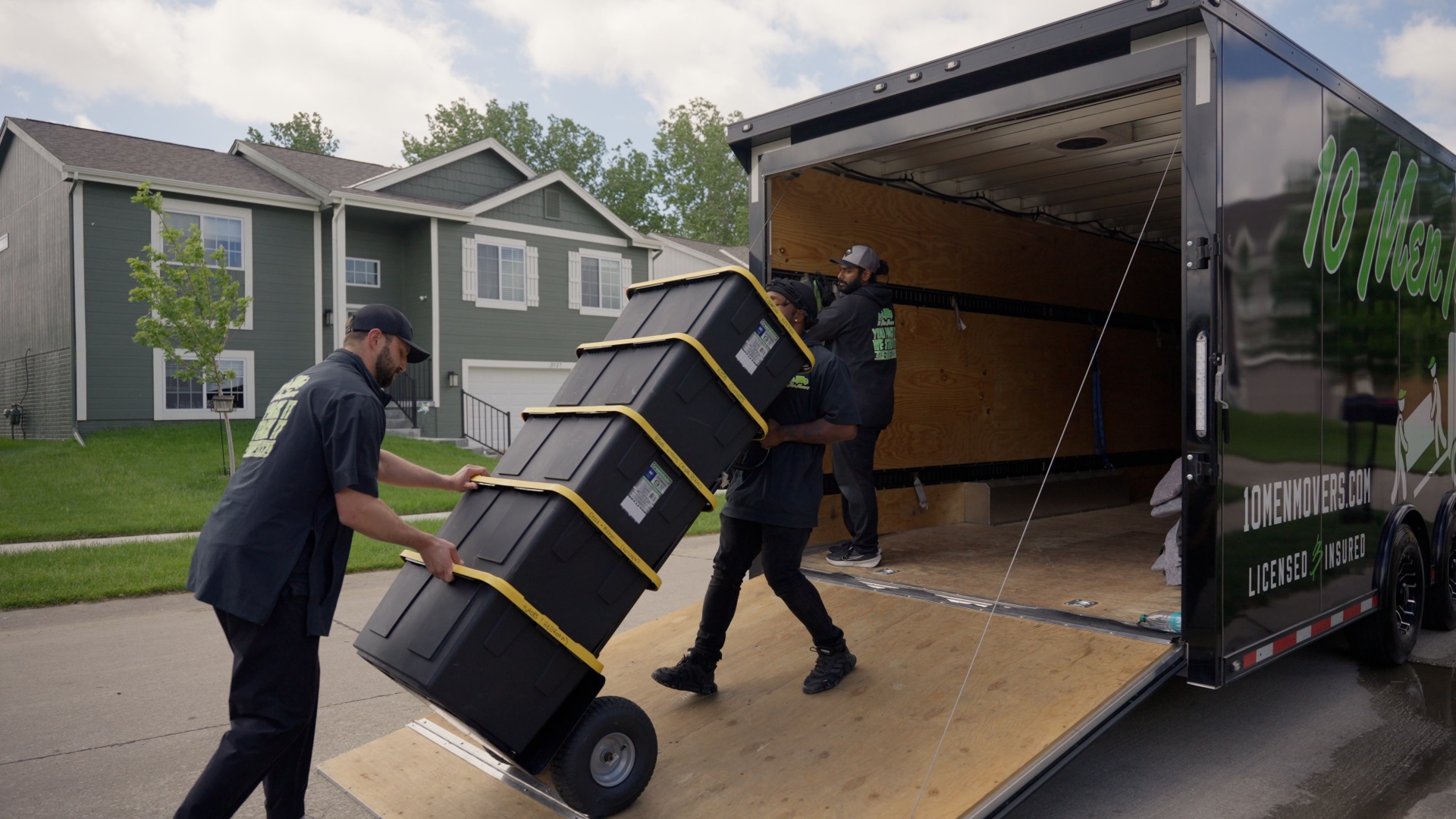 10 Men Movers crew loading boxes into truck