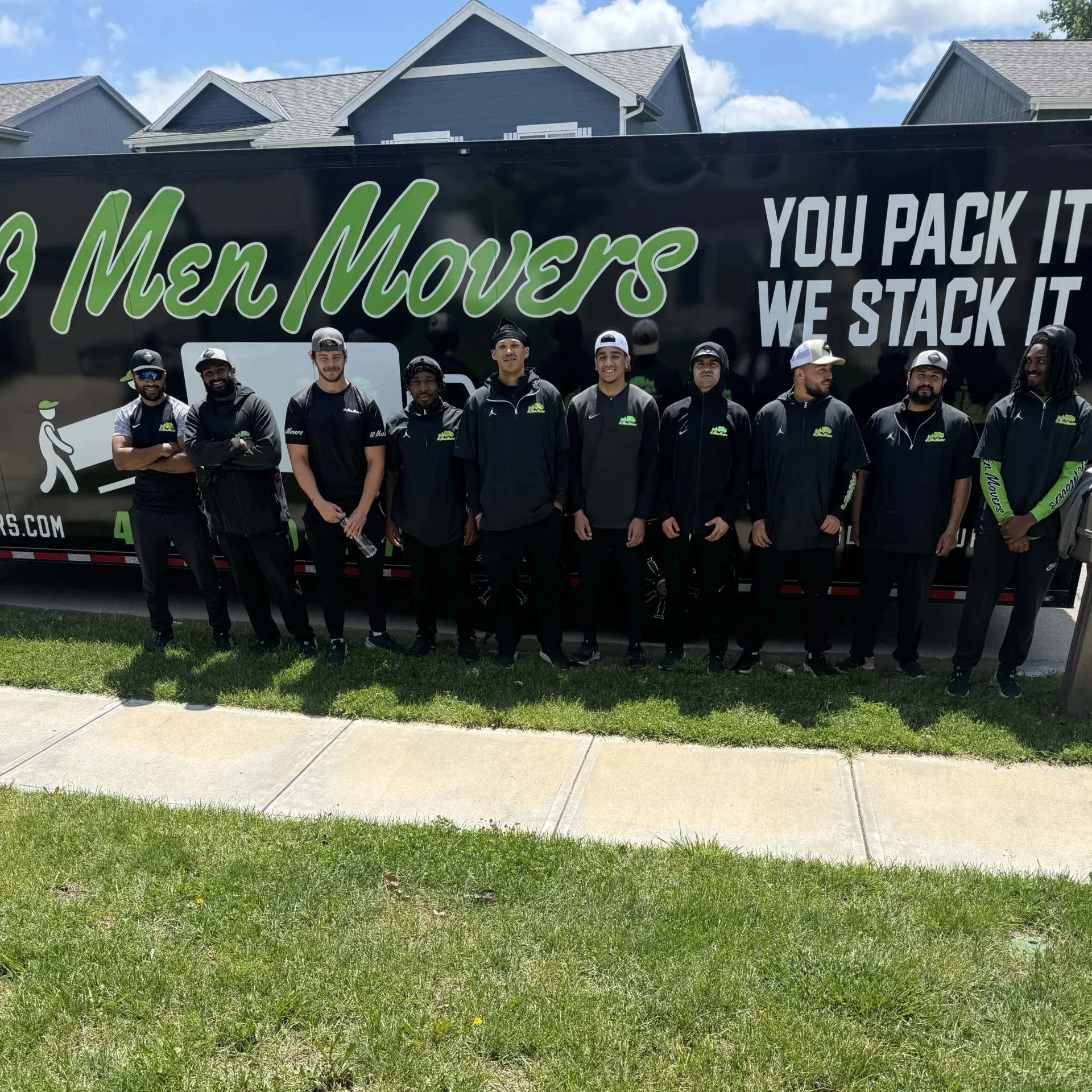 Team of 10 Men Movers in front of their branded moving truck, showcasing professionalism and teamwork in Omaha.