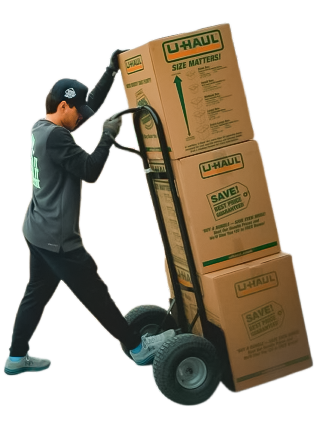 Mover transporting stacked U-Haul boxes on a hand truck, emphasizing efficient moving services.